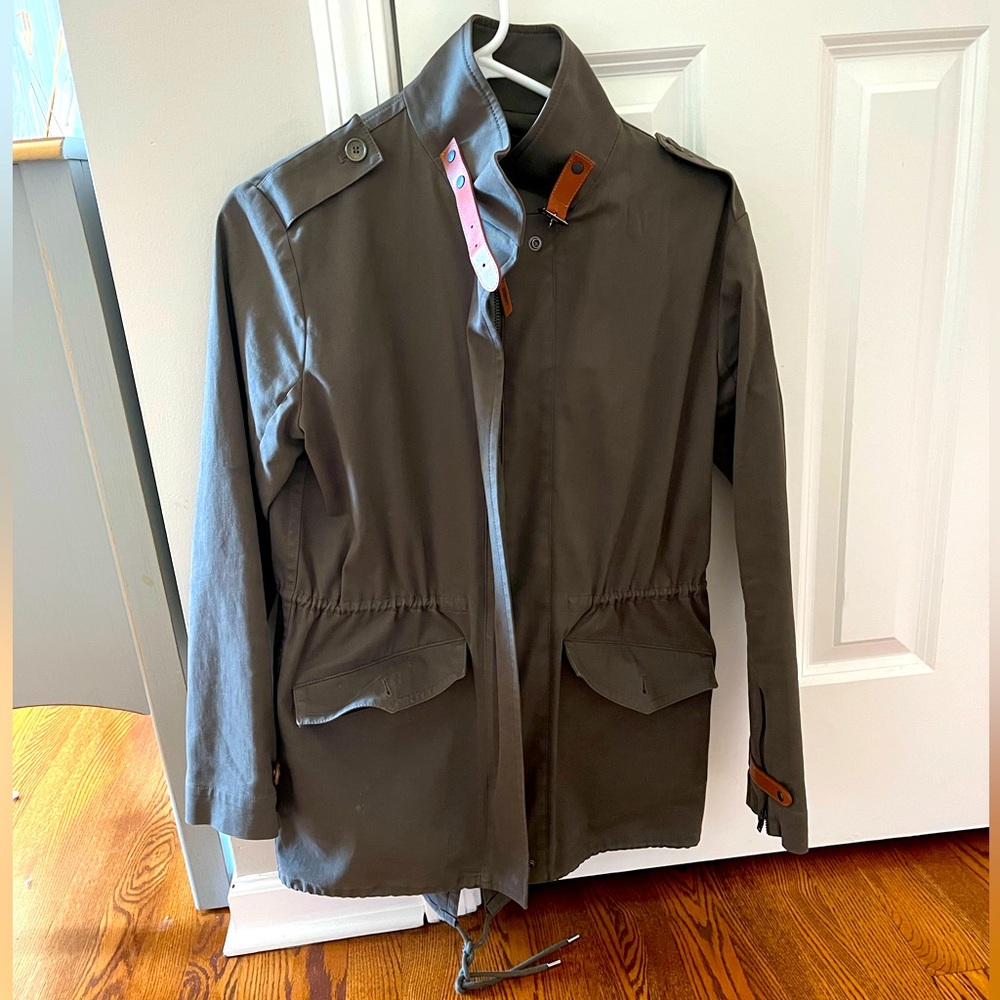 Army green Lacoste coat with leather strap details